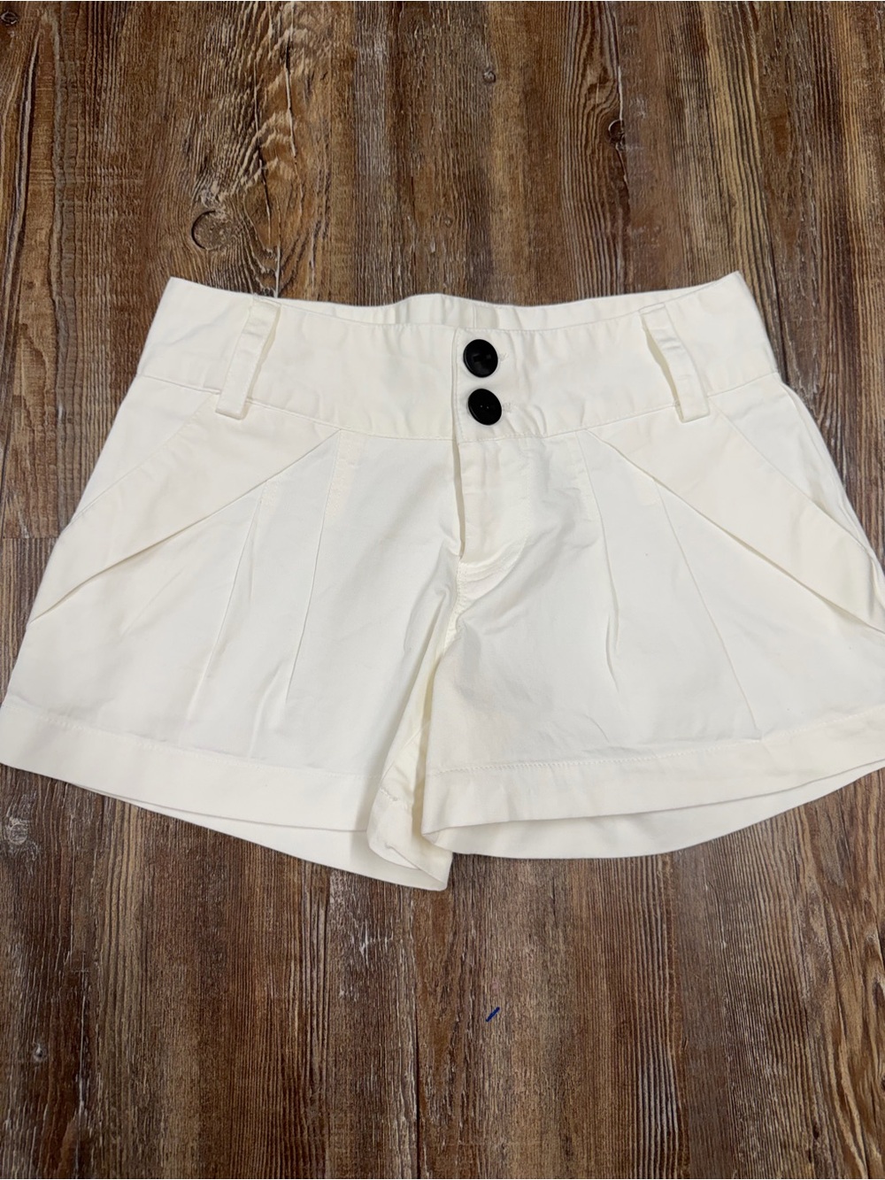 Vintage White low rise shorts with button detail, size M